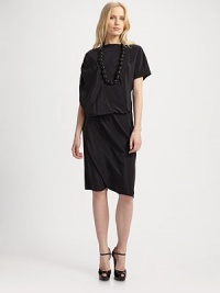 Shimmery silk is draped into a bold, asymmetrical-sleeved blouson style. Boatneck Asymmetrical sleeves Ruched shoulder detail Blouson bodice Elastic waist About 45 from shoulder to hem Silk Dry clean Imported Shimmery silk is draped into a bold, asymmetrical-sleeved blouson style. Boatneck Asymmetrical sleeves Ruched shoulder detail Blouson bodice Elastic waist About 45 from shoulder to hem Silk Dry clean Imported