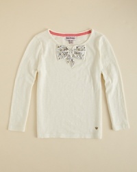 Juicy Couture indulges a flight of fancy, adding goldtone stud accents and a rhinestone bowtie to an elegant longsleeve top. Juicy Couture indulges a flight of fancy, adding goldtone stud accents and a rhinestone bowtie to an elegant longsleeve top.