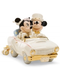 Honeymoon in Disney. Newlyweds Minnie and Mickey Mouse are the picture of happiness in a car is made for the occasion, with M&M vanity plates, luxe gold detail and cans tied to the bumper, all in beautiful Lenox porcelain. Honeymoon in Disney. Newlyweds Minnie and Mickey Mouse are the picture of happiness in a car is made for the occasion, with M&M vanity plates, luxe gold detail and cans tied to the bumper, all in beautiful Lenox porcelain.