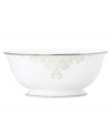 Refine your formal table with classic cream and white Lenox dinnerware. Dishes, including this Opal Innocence Scroll bone china serving bowl, are trimmed in platinum and accented with a raised dot and scroll pattern, bringing contemporary grace to special occasions. A pearlized finish adds subtle shimmer.