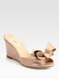A comfortable wedge lifts this bow-trimmed silhouette, expertly crafted in Italy of luxurious patent leather. Self-covered heel, 3 (75mm)Patent leather upperLeather lining and solePadded insoleMade in Italy A comfortable wedge lifts this bow-trimmed silhouette, expertly crafted in Italy of luxurious patent leather. Self-covered heel, 3 (75mm)Patent leather upperLeather lining and solePadded insoleMade in Italy