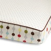 Bright, multicolored dots in a linear pattern and a small pin dot pattern are separated by brown linen piping.The American Academy of Pediatrics and the U.S. Consumer Product Safety Commission have made recommendations for safe bedding practices for babies. When putting infants under 12 months to sleep, remove pillows, quilts, comforters, and other soft items from the crib.