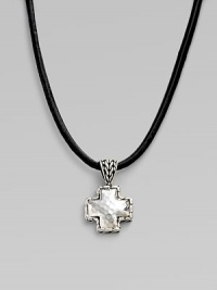 A simple leather cord holds a small cross pendant forged with a hammered finish in pure silver. Cord, 18-20 adjustable Lobster clasp closure Imported 