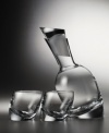 Add a dash of style to your bar with the Tilt decanter set. The unique, slanted design will lend sophistication to all of your entertaining events. Includes two double old-fashioned glasses.