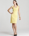 The sleek shift gets a seasonal update with a sweet lemony hue and playful sunburst neckline. Add statement jewels for a night out or pair with a cardigan for workweek chic.