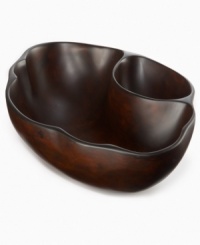 Carved and sanded by hand, the Selena chip and dip bowl--designed by Einstein Albert for Heart of Haiti serveware--is made from the wood of sustainable obeche trees that are farm raised and harvested by the artisans themselves. A rich stain highlights the organic beauty of a serving piece that's inspired by the moon goddess, but entirely down to earth. Carved and sanded by hand, the Selena chip and dip bowl--designed by Einstein Albert for Heart of Haiti serveware--is made from the wood of sustainable obeche trees that are farm raised and harvested by the artisans themselves. A rich stain highlights the organic beauty of a serving piece that's inspired by the moon goddess, but entirely down to earth.