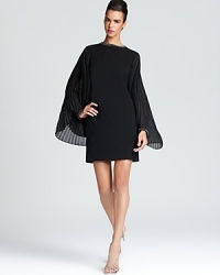 Channel 60's style with Laundry by Shelli Segal's Mad Men inspired creation, crafted with authentic details like vintage-inspired rhinestone beading and pleated cape sleeves. Channel 60's style with Laundry by Shelli Segal's Mad Men inspired creation, crafted with authentic details like vintage-inspired rhinestone beading and pleated cape sleeves.