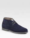 An ankle-high profile with two-eyelet construction in rich suede. Leather lining Padded insole Rubber sole Made in Italy 