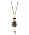 Enter Betsey Johnson's web of influence with this cameo and necklace, featuring a spider motif. Crafted from gold-tone mixed metal, the necklace features bow and flower details, a black oval locket and a teardrop glass crystal accent dangling down. Approximate length: 30 inches + 3-inch extender. Approximate drop (locket): 3-3/4 inches. Approximate drop (frontal chain): 5-1/4 inches.
