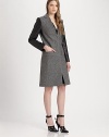 Power dressing in its finest form, this tailored, wool-rich coat has modern seaming, croc-print faux leather sleeves and a back vent for comfort. V-neckCroc-print faux leather sleevesSlash pocketsBack ventAbout 39 from shoulder to hem80% virgin wool/20% polyamideDry cleanImported of Italian fabricModel shown is 5'10 (177cm) wearing US size 2.