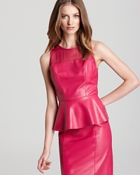 A leather Sachin + Babi top cut in the season's peplum-embellished silhouette flaunts sheer chiffon at the yoke and back for an alluring accent. Paired with a matching pencil skirt, the ensemble is a haute hit. A leather Sachin + Babi top cut in the season's peplum-embellished silhouette flaunts sheer chiffon at the yoke and back for an alluring accent. Paired with a matching pencil skirt, the ensemble is a haute hit.