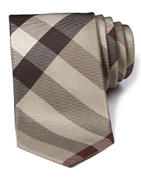 A signature check print tie from Burberry, handmade in England. A signature check print tie from Burberry, handmade in England.
