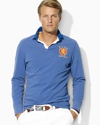 Cut for a trim, athletic fit, a long-sleeved rugby is rendered in lightweight utility jersey with diamond-quilted detailing and bold stripes for masculine polish. Cut for a trim, athletic fit, a long-sleeved rugby is rendered in lightweight utility jersey with diamond-quilted detailing and bold stripes for masculine polish.