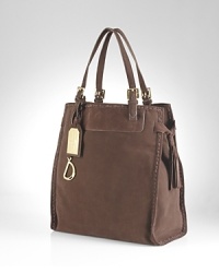 Richly crafted from suede, this Lauren Ralph Lauren tote is sure to top must lists with an effortless silhouette and ever-chic look. Richly crafted from suede, this Lauren Ralph Lauren tote is sure to top must lists with an effortless silhouette and ever-chic look.