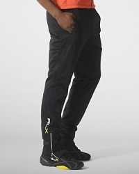 Designed for high-level comfort and superior performance, an athletic track pant is crafted in sleek stretch microfiber with hydro-mesh panels and reflective graphics. Designed for high-level comfort and superior performance, an athletic track pant is crafted in sleek stretch microfiber with hydro-mesh panels and reflective graphics.