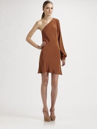 A rusty hue of rich silk rendered in a stunning asymmetrical silhouette.Asymmetrical neckline Bishop sleeve with button cuff About 32 from shoulder to hem Silk; dry clean Imported A rusty hue of rich silk rendered in a stunning asymmetrical silhouette.Asymmetrical neckline Bishop sleeve with button cuff About 32 from shoulder to hem Silk; dry clean Imported