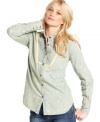 An allover floral print adds a hint of femininity to this otherwise boyish chambray shirt by Free People! (Clearance)