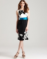 Master modern elegance in this Elie Tahari dress, blooming with bold florals for a striking silhouette. A vibrant belt cinches the waistline for a feminine, curve-enhancing finish.