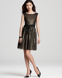 Metallic mesh shines on this Mark + James by Badgley Mischka dress, lending festive flair to the evening's events. Metallic mesh shines on this Mark + James by Badgley Mischka dress, lending festive flair to the evening's events.