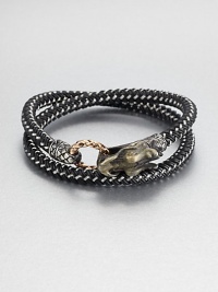 From the Naga Collection. A bold, braided strand of black nylon cord wraps the wrist twice, then clasps with a woven bronze ring and a Naga dragon hook of sterling silver.NylonSterling silver and bronzeStrap width, about .25Diameter, about 2.5Hook-and-ring closureMade in Bali