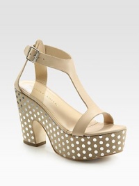 Polka-dotted leather silhouette with a sculpted heel, chunky platform and an adjustable ankle strap. Self-covered heel, 4½ (115mm)Island platform, 2 (50mm)Compares to a 2½ heel (65mm)Leather upperLeather lining and solePadded insoleImportedOUR FIT MODEL RECOMMENDS ordering true size. Polka-dotted leather silhouette with a sculpted heel, chunky platform and an adjustable ankle strap. Self-covered heel, 4½ (115mm)Island platform, 2 (50mm)Compares to a 2½ heel (65mm)Leather upperLeather lining and solePadded insoleImportedOUR FIT MODEL RECOMMENDS ordering true size.