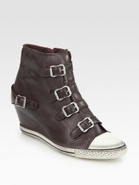 Get noticed wearing these cool leather kicks with a sneaker-inspired cap toe, elevated wedge and buckle straps. Hidden wedge, 3¼ (80mm)Rubber platform, ½ (15mm)Compares to a 2¾ heel (70mm)Leather upper with rubber cap toe Side zip and adjustable buckle strapsLeather liningRubber solePadded insoleImportedOUR FIT MODEL RECOMMENDS ordering true size. Get noticed wearing these cool leather kicks with a sneaker-inspired cap toe, elevated wedge and buckle straps. Hidden wedge, 3¼ (80mm)Rubber platform, ½ (15mm)Compares to a 2¾ heel (70mm)Leather upper with rubber cap toe Side zip and adjustable buckle strapsLeather liningRubber solePadded insoleImportedOUR FIT MODEL RECOMMENDS ordering true size.