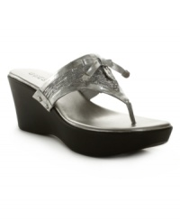Sequins are a girl's best friend! Full of shimmer and shine, the Reggee wedge sandals from GUESS are a classic thong sandal updated with a trendy elevated wedge. Take them for a stroll on the boardwalk or at the park. Sequins are a girl's best friend! Full of shimmer and shine, the Reggee wedge sandals from GUESS are a classic thong sandal updated with a trendy elevated wedge. Take them for a stroll on the boardwalk or at the park.