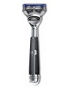 The Fusion Chrome Collection POWER RAZOR from The Art of Shaving is perfectly balanced and weighted to feel like a natural extension of your hand, maximizing stability and control. Gentle micro pulses reduce friction and increase razor glide. The built in spotlight, the first of its kind, reveals details normally in shadow-such as under the chin and jaw line-to help you avoid missed spots and make every stroke count. The sleek, contemporary handle is an ideal combination of ergonomics and innovative design, handcrafted in polished chrome andwrapped in a matte black, thermo resin grip.NEW! Fusion ® ProGlide ™ Power is Gillette's most advanced blade ever. On the front, thinner, finer blades glide effortlessly with less tug and pull for incredible comfort. On the back, the re-designed Precision trimmer with improved blade allows you to trim sideburns easily, shave under the nose and shape facial hair.Includes an 8-Pack of replacement ProGlide Blades. A $32 value.