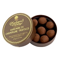 Lightly dusted dark chocolate truffles with a Marc de Champagne center. Lightly dusted dark chocolate truffles with a Marc de Champagne center.