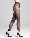 Feel footloose and fancy free in these scallop openwork tights in microfiber from Ralph Lauren.