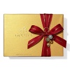 A classic assortment of Belgian chocolates from Godiva comes in a beautiful gold box tied with big red bow and holiday pick. Each ballotin includes Godiva signature favorite ganaches, pralines, caramels, fruits and nuts in milk, dark and white chocolate.