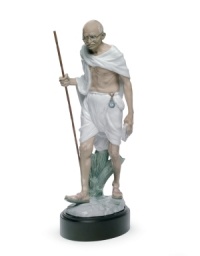 An homage to political activist and revered philosopher Mahatma Gandhi, this elaborate Lladro collectible depicts the historic figure in artfully glazed porcelain. An homage to political activist and revered philosopher Mahatma Gandhi, this elaborate Lladro collectible depicts the historic figure in artfully glazed porcelain.