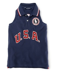 A red, white and blue design with U.S.A. patching and embroidered emblems gives a preppy, all-American look to the classic sleeveless polo, celebrating Team USA's participation in the 2012 Olympics. A red, white and blue design with U.S.A. patching and embroidered emblems gives a preppy, all-American look to the classic sleeveless polo, celebrating Team USA's participation in the 2012 Olympics.