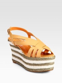 Crisscrossing leather straps encase the foot in a striped espadrille wedge design. Hemp wedge, 4 (100mm)Hemp platform, 3 (75mm)Compares to a 1 heel (25mm)Leather upperLeather lining and solePadded insoleMade in Spain Crisscrossing leather straps encase the foot in a striped espadrille wedge design. Hemp wedge, 4 (100mm)Hemp platform, 3 (75mm)Compares to a 1 heel (25mm)Leather upperLeather lining and solePadded insoleMade in Spain