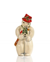 Shaped with a vintage chocolate mold for sweet, one-of-a-kind style, this charming Vaillancourt snowman figurine is hand painted in a dapper red hat and green scarf for extra-festive flair. Shaped with a vintage chocolate mold for sweet, one-of-a-kind style, this charming Vaillancourt snowman figurine is hand painted in a dapper red hat and green scarf for extra-festive flair.