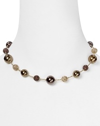 Embellished with delicate pearl and crystal stations, Carolee's illusion necklace sparkles with versatility -- elegant whether worn to dress up denim or enliven a classic white blouse. Embellished with delicate pearl and crystal stations, Carolee's illusion necklace sparkles with versatility -- elegant whether worn to dress up denim or enliven a classic white blouse.