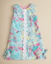 A sleeveless dress in the Lilly Pulitzer classic shift silhouette, adorned with allover beach prints and lace trim.