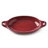 Inspired by discoveries in South America, DVF designs bakeware. Sized to chef's standards, deeply colored in DVF style and given a brilliant glaze, this oven-to-table collection is as decorative as it is functional. Safe to use in the oven and on the table. Stoneware with reactive glaze, knob in Riverstone shape.
