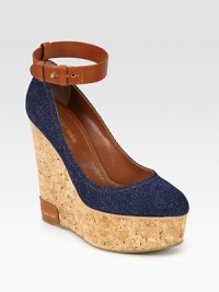 Comfortable cork wedge with a stretch denim upper and an adjustable leather ankle strap. Cork and leather wedge, 5 (125mm)Cork platform, 2 (50mm)Compares to a 3 heel (75mm)Denim and leather upperLeather liningRubber solePadded insoleMade in Spain Comfortable cork wedge with a stretch denim upper and an adjustable leather ankle strap. Cork and leather wedge, 5 (125mm)Cork platform, 2 (50mm)Compares to a 3 heel (75mm)Denim and leather upperLeather liningRubber solePadded insoleMade in Spain