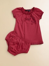 A frilly, girlie set with lace trim, bows and matching bloomers is perfect for any occasion.Crewneck with lace trimShort cap sleeves with lace trimPullover styleGathered bodiceA-line silhouetteMatching bloomers have elastic waistband and leg openingsCottonMachine washImported