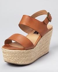 STEVEN BY STEVE MADDEN adopts the season's favorite trend in footwear--the flatform silhouette looks fresh in luxe leather and a raffia-wrapped sole. STEVEN BY STEVE MADDEN adopts the season's favorite trend in footwear--the flatform silhouette looks fresh in luxe leather and a raffia-wrapped sole.