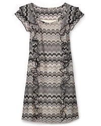 Modern and playful, this Aqua ruffle dress flaunts the season's trend-right zig-zag pattern in sophisticated shades of cream, gray and black. Modern and playful, this Aqua ruffle dress flaunts the season's trend-right zig-zag pattern in sophisticated shades of cream, gray and black.