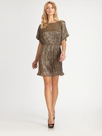 A breezy blouson silhouette defines this shimmering metallic knit style.BoatneckShort cape sleevesElastic waistAbout 18 from natural waistPolyesterDry cleanImportedModel shown is 5'10 (177cm) wearing US size 4. A breezy blouson silhouette defines this shimmering metallic knit style.BoatneckShort cape sleevesElastic waistAbout 18 from natural waistPolyesterDry cleanImportedModel shown is 5'10 (177cm) wearing US size 4.