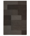 An abstract pattern makes a bold, modern statement upon this inviting Bowery area rug from Calvin Klein. Generously thick wool fibers are hand tufted in India for remarkable strength and detailed design.