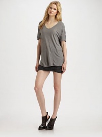 Comfy, silk-blend style with dropped shoulders and a rounded v-neck. Rounded v-neck Short sleeves Dropped shoulders Longer length hits below the hips 67% rayon/33% silk Hand wash Imported Comfy, silk-blend style with dropped shoulders and a rounded v-neck. Rounded v-neck Short sleeves Dropped shoulders Longer length hits below the hips 67% rayon/33% silk Hand wash Imported