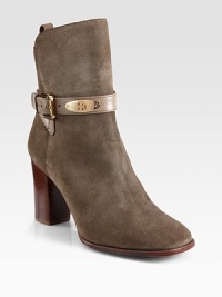 Must-have style and superior craftsmanship converge in this suede design with a criss-cross leather strap and stacked heel. Stacked heel, 3¼ (80mm)Suede and leather upperPull-on style with adjustable ankle strapLeather lining and solePadded insoleImported Must-have style and superior craftsmanship converge in this suede design with a criss-cross leather strap and stacked heel. Stacked heel, 3¼ (80mm)Suede and leather upperPull-on style with adjustable ankle strapLeather lining and solePadded insoleImported