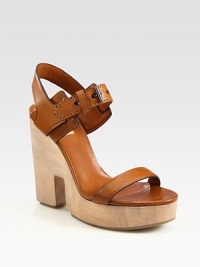 Sculpted wooden wedge with adjustable, burnished leather straps and a secure slingback strap. Wooden cutout wedge, 4¾ (120mm)Wooden platform, 1½ (40mm)Compares to a 3¼ heel (80mm)Leather upperLeather liningRubber solePadded insoleMade in ItalyOUR FIT MODEL RECOMMENDS ordering one half size up as this style runs small. Sculpted wooden wedge with adjustable, burnished leather straps and a secure slingback strap. Wooden cutout wedge, 4¾ (120mm)Wooden platform, 1½ (40mm)Compares to a 3¼ heel (80mm)Leather upperLeather liningRubber solePadded insoleMade in ItalyOUR FIT MODEL RECOMMENDS ordering one half size up as this style runs small.