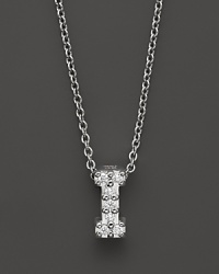 From the Tiny Treasures collection, a diamond I necklace. With signature ruby accent. Designed by Roberto Coin. From the Tiny Treasures collection, a diamond I necklace. With signature ruby accent. Designed by Roberto Coin.