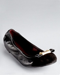 MARC BY MARC JACOBS' now iconic logo plate stakes its claim at the front of a classic cap toe ballet flat, adorned in soft suede with a modern bow. MARC BY MARC JACOBS' now iconic logo plate stakes its claim at the front of a classic cap toe ballet flat, adorned in soft suede with a modern bow.