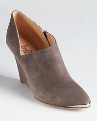 A pointed toe, v-shaped side and metal details infuse attitude into Belle by Sigerson Morrison's soft suede Felicia booties. A pointed toe, v-shaped side and metal details infuse attitude into Belle by Sigerson Morrison's soft suede Felicia booties.